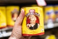 Shoppers hand holding a package of mexican chocolate abuelita brand