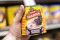 Shoppers hand holding a package of mexican chocolate Ibarra brand