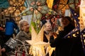 Christmas Market Stand Selling Colourful Illuminated Festive Stars.