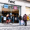 Shoppers Outside A Next High Street Fashion Shop During COVID-19 Coronavirus