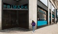 Shoppers pass a closed Primark shop on Oxford Street, London