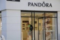 SHOPPERS PASS BY PANDORA STORE