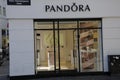 SHOPPERS PASS BY PANDORA STORE