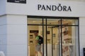 SHOPPERS PASS BY PANDORA STORE