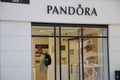 SHOPPERS PASS BY PANDORA STORE