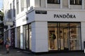 SHOPPERS PASS BY PANDORA STORE