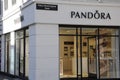 SHOPPERS PASS BY PANDORA STORE