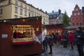 Shoppers purchase items at a Christmas village in Gamla stan, the old town of Stockholm, Sweden Royalty Free Stock Photo