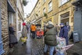 Shoppers and stalls on Catherine Hill at Frome Christmas Sunday Market in Frome, Somerset, UK Royalty Free Stock Photo