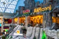 Shoppers visit the mall during winter at discount and sale season. Food court in AFI Cotroceni Shopping Mall in Bucharest, Romania Royalty Free Stock Photo