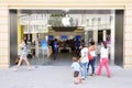 Shoppers Walk to an Apple Store Royalty Free Stock Photo