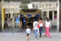 Shoppers Walk to an Apple Store