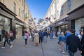 Shoppers walking under a canopy of brightly coloured butterflies in Southgate Shopping Centre in Bath, Avon, UK