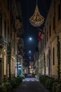 Shopping alley in Milan by night in a cinematic view