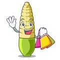 Shopping baby corn isolated with the mascot