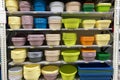 Shopping with background of colorful plastic baskets, bowls and basins on shelf. Inexpensive alternative to dishes made from Royalty Free Stock Photo