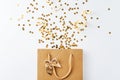 Shopping bag with festive confetti on white background
