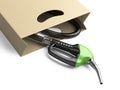 Shopping bag with green fuel pump nozzle. Royalty Free Stock Photo