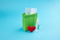 Shopping bag with hand sanitizer, medical face mask and heart symbol. covid-19 stockpile concept