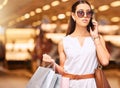 Shopping bag, phone call and woman in mall for fashion, sale or discount deal. Customer person with retail bags Royalty Free Stock Photo