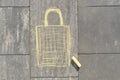 Shopping bag picture written on gray sidewalk in crayons Royalty Free Stock Photo