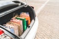Shopping bags in car trunk or hatchback, with copy space. Modern shopping lifestyle, rich people or leisure activity concept Royalty Free Stock Photo