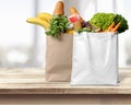 Shopping bags with groceries on white Royalty Free Stock Photo