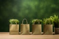 Shopping bags made from craft paper full of green grass with copy space