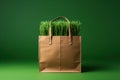 Shopping bags made from craft paper full of green grass with copy space