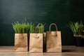 Shopping bags made from craft paper full of green grass with copy space