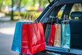 Shopping bags and supplies needs in family car trunk at a shopping mall parking Royalty Free Stock Photo