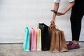 Shopping bags of women crazy shopaholic lady put on cement ground floor Royalty Free Stock Photo