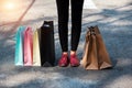 Shopping bags of women crazy shopaholic person at shopping mall,put on cement ground floor Royalty Free Stock Photo