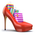 Shopping bags in women high heel shoes. Concept of consumerism.