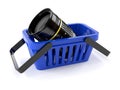 Shopping basket with camera lens Royalty Free Stock Photo