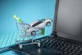 Shopping basket with car on laptop keyboard on blue background. Concept of online shopping vehicles on the Internet Royalty Free Stock Photo