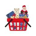 Shopping basket with Christmas gifts, Teddy bear and Santa Claus Royalty Free Stock Photo