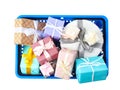 Shopping basket full of gift boxes on white, top view Royalty Free Stock Photo