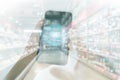 Shopping basket on a mobile phone screen. Woman Hand holding mobile phone on Supermarket blur background Royalty Free Stock Photo