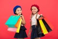 Shopping become fun with best friends. Kids cute schoolgirls hold bunch shopping bags. Children satisfied by shopping