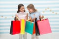 Shopping with best friend concept. Girls like shopping. Kids happy small girls hold shopping bags. Enjoy shopping with