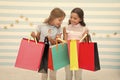 Shopping with best friend concept. Girls like shopping. Kids happy small girls hold shopping bags. Enjoy shopping with