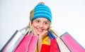 Shopping on black friday. Girl amazed face knitted hat hold shopping bags white background. Amazing shopping concept