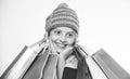 Shopping on black friday. Girl amazed face knitted hat hold shopping bags white background. Amazing shopping concept