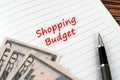 Shopping budget text on notepad Royalty Free Stock Photo