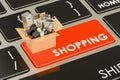 Shopping button on keyboard with cardboard box full of home appliances, 3D rendering