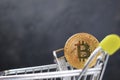 Shopping cart and bitcoin. Concept of cryptocurrency market Royalty Free Stock Photo