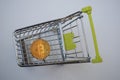 Shopping cart and bitcoin. Concept of cryptocurrency market Royalty Free Stock Photo