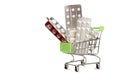 Shopping cart with blisters of tablets and pills concept of self-treatment and purchase of medicines