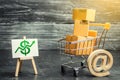 A shopping cart with boxes symbolizing internet trading and a stand with a green up arrow. shopping online. Internet network trade